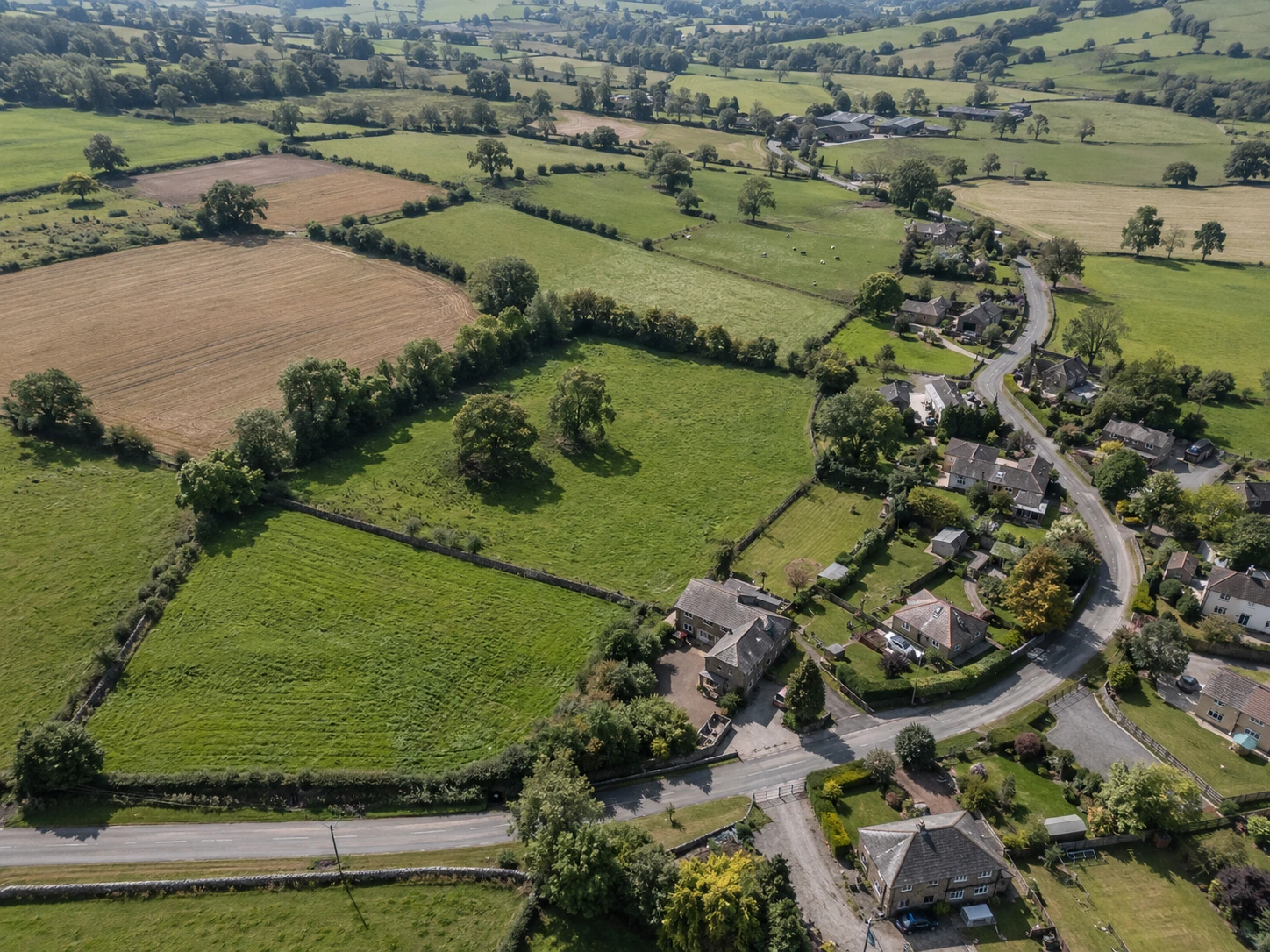 Illustrative aerial view of land parcels and surrounding terrain